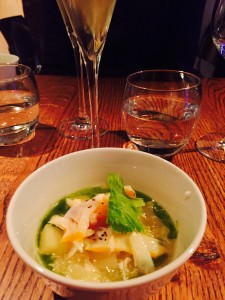 Vegetable broth with steamed haddock and chive oil with champagne, at Spring